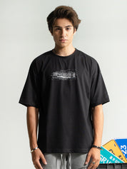 Death Note tee male model side angle black oversized anime streetwear Pakistan – GROOVY