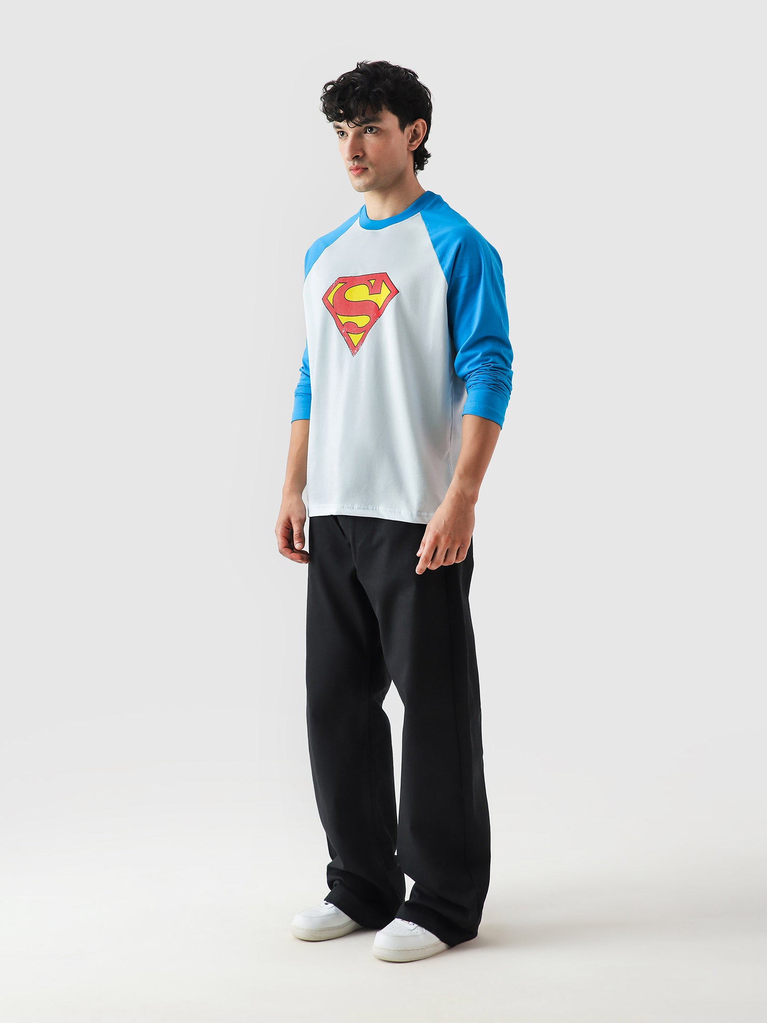 Superman full sleeves tee male model side angle raglan streetwear Pakistan – GROOVY