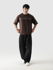 DICES GRVY oversized tee male model side angle mocha brown streetwear Pakistan – GROOVY