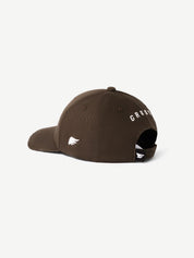 Brown cap with white logo and text on a white background