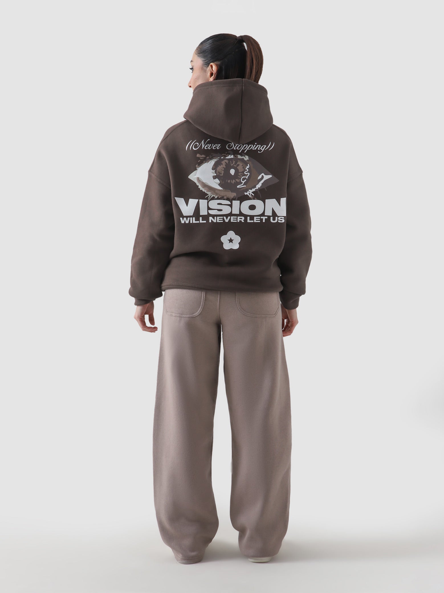 Never Stopping Culture hoodie female model front view chocolate brown Pakistan – GROOVY