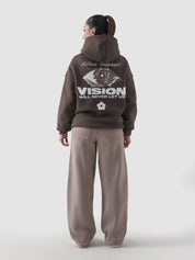 Never Stopping Culture hoodie female model front view chocolate brown Pakistan – GROOVY