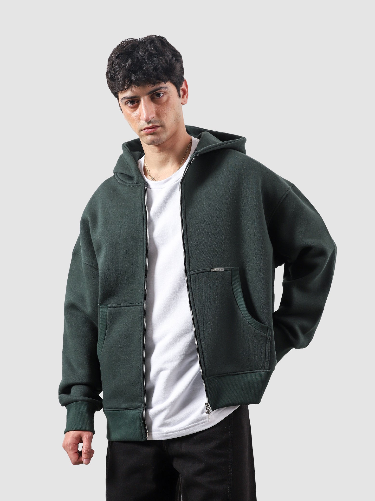Racing green essential zipper hoodie female model front view oversized Pakistan – GROOVY