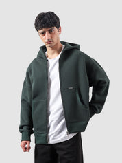Racing green essential zipper hoodie female model front view oversized Pakistan – GROOVY