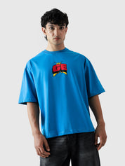 MONEY LOVES ENERGY tee female model front view oversized blue Pakistan – GROOVY