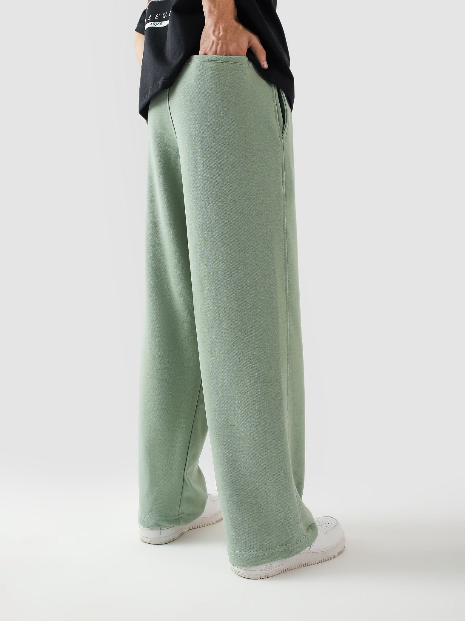 Sage green baggy trousers female model front view relaxed fit Pakistan – GROOVY