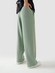 Sage green baggy trousers female model front view relaxed fit Pakistan – GROOVY
