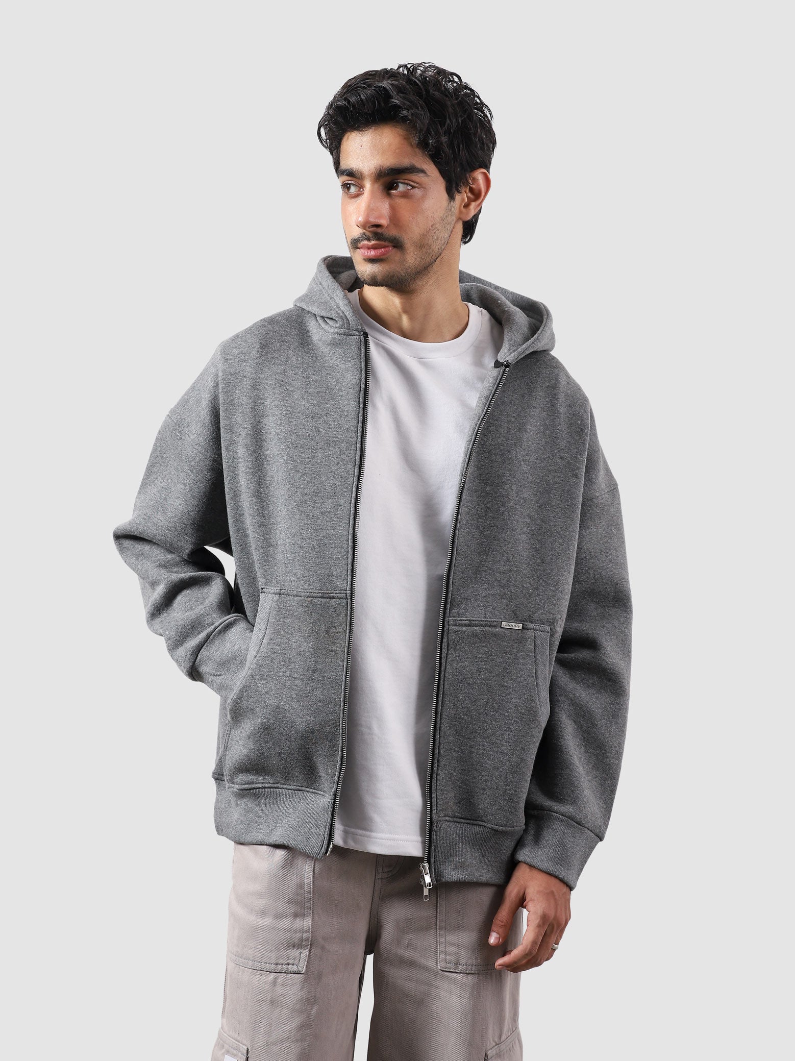 Dark heather grey essential zipper hoodie female model front view oversized Pakistan – GROOVY