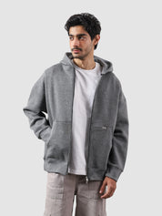 Dark heather grey essential zipper hoodie female model front view oversized Pakistan – GROOVY