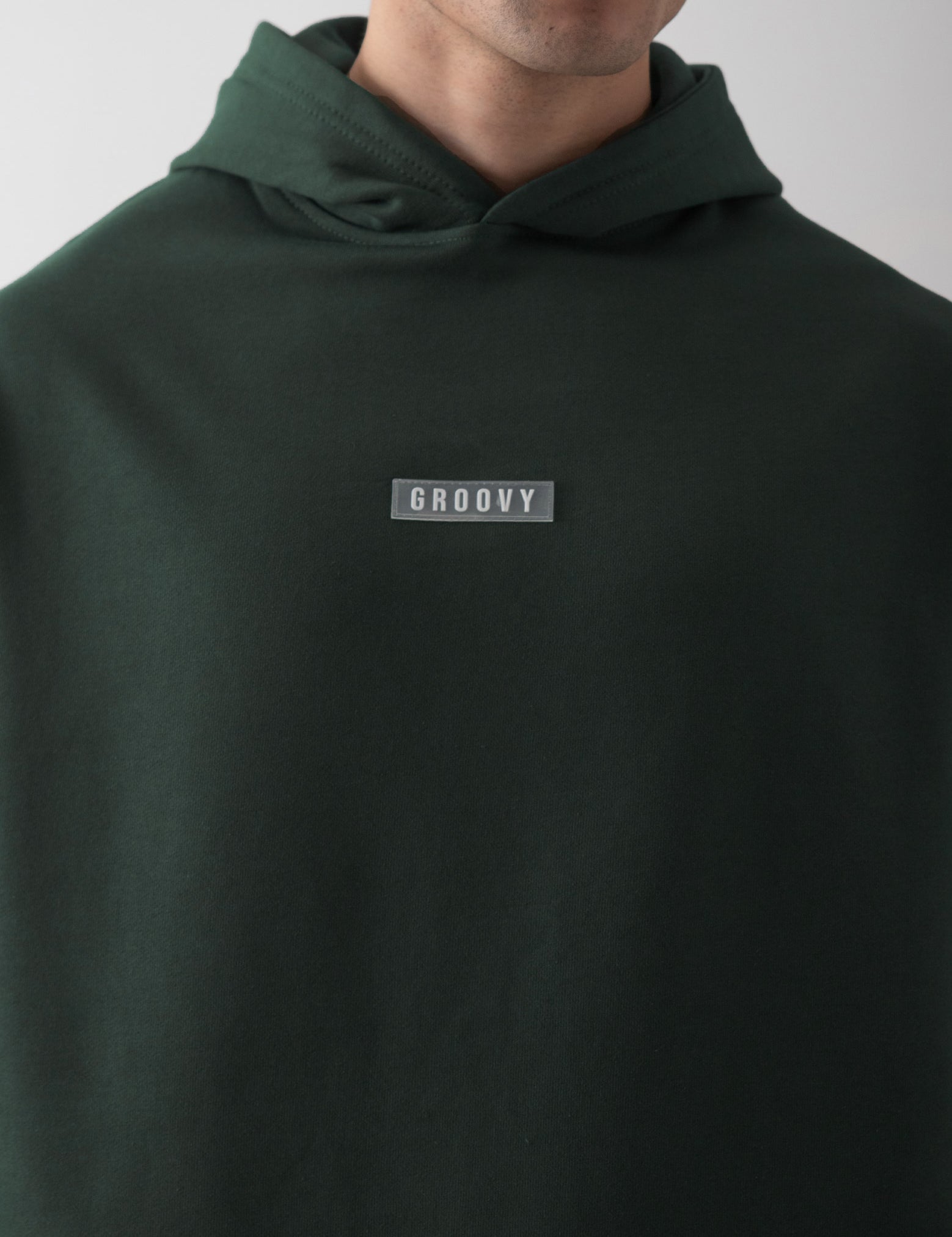 Dark green oversized hoodie female model back view relaxed fit Pakistan – GROOVY