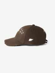 Brown cap with white designs on a white background