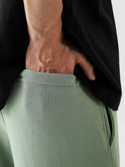 Sage green baggy trousers female model back view adjustable waistband Pakistan – GROOVY