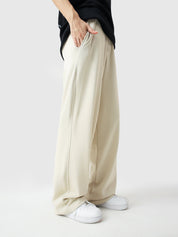 Cream baggy trousers seated lifestyle shot streetwear couple Pakistan – GROOVY