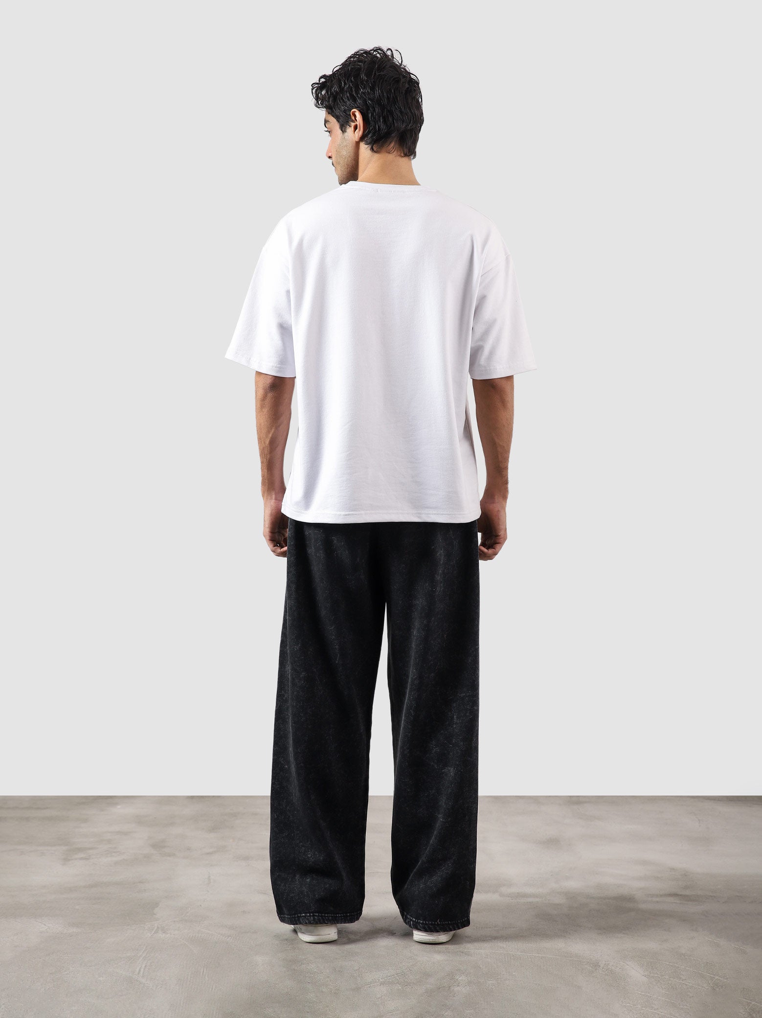 Reverse washed cargo pants couple lifestyle shot washed streetwear Pakistan – GROOVY