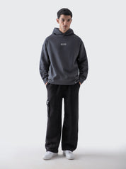Dark grey oversized hoodie female model front view relaxed fit Pakistan – GROOVY