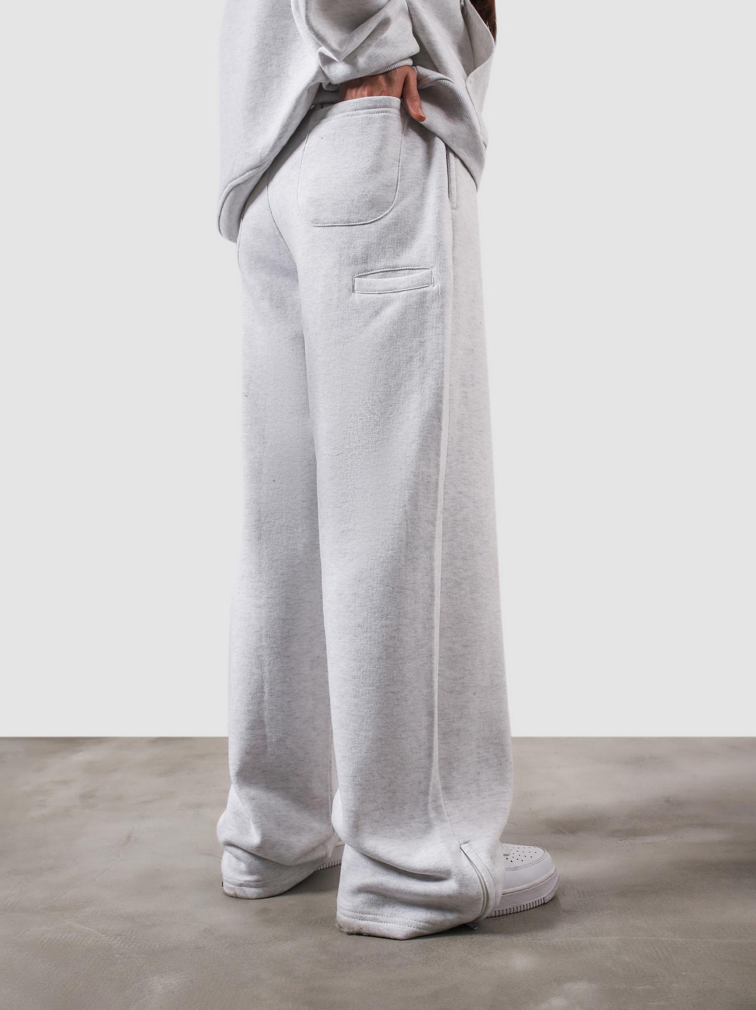 Utility Sweats arctyc white female model back view streetwear Pakistan – GROOVY