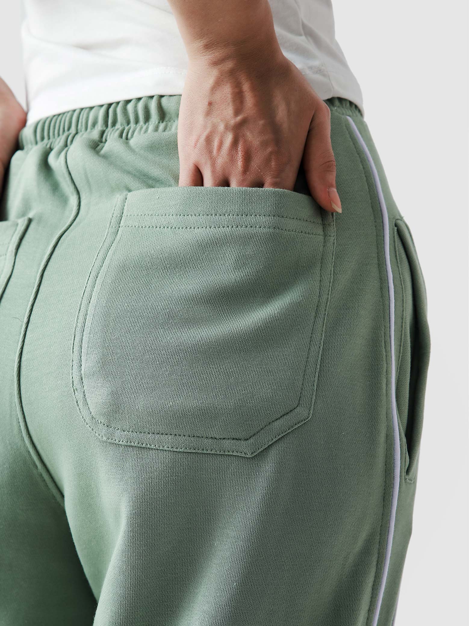 Piping trouser sage green couple lifestyle shot streetwear Pakistan – GROOVY