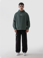 Hunter green hoodie male model half body lifestyle shot Pakistan – GROOVY