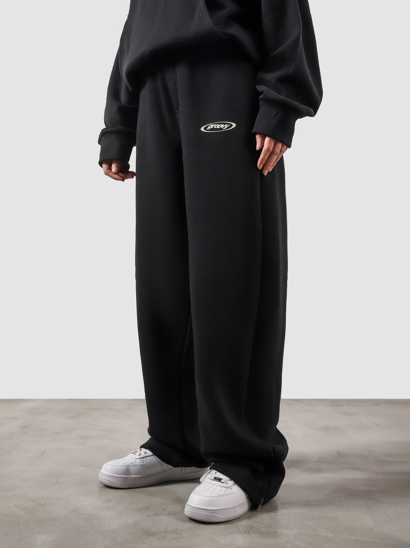 Utility Sweats black couple lifestyle shot streetwear Pakistan – GROOVY