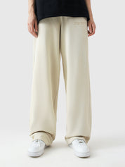 Cream baggy trousers female model back view relaxed fit Pakistan – GROOVY