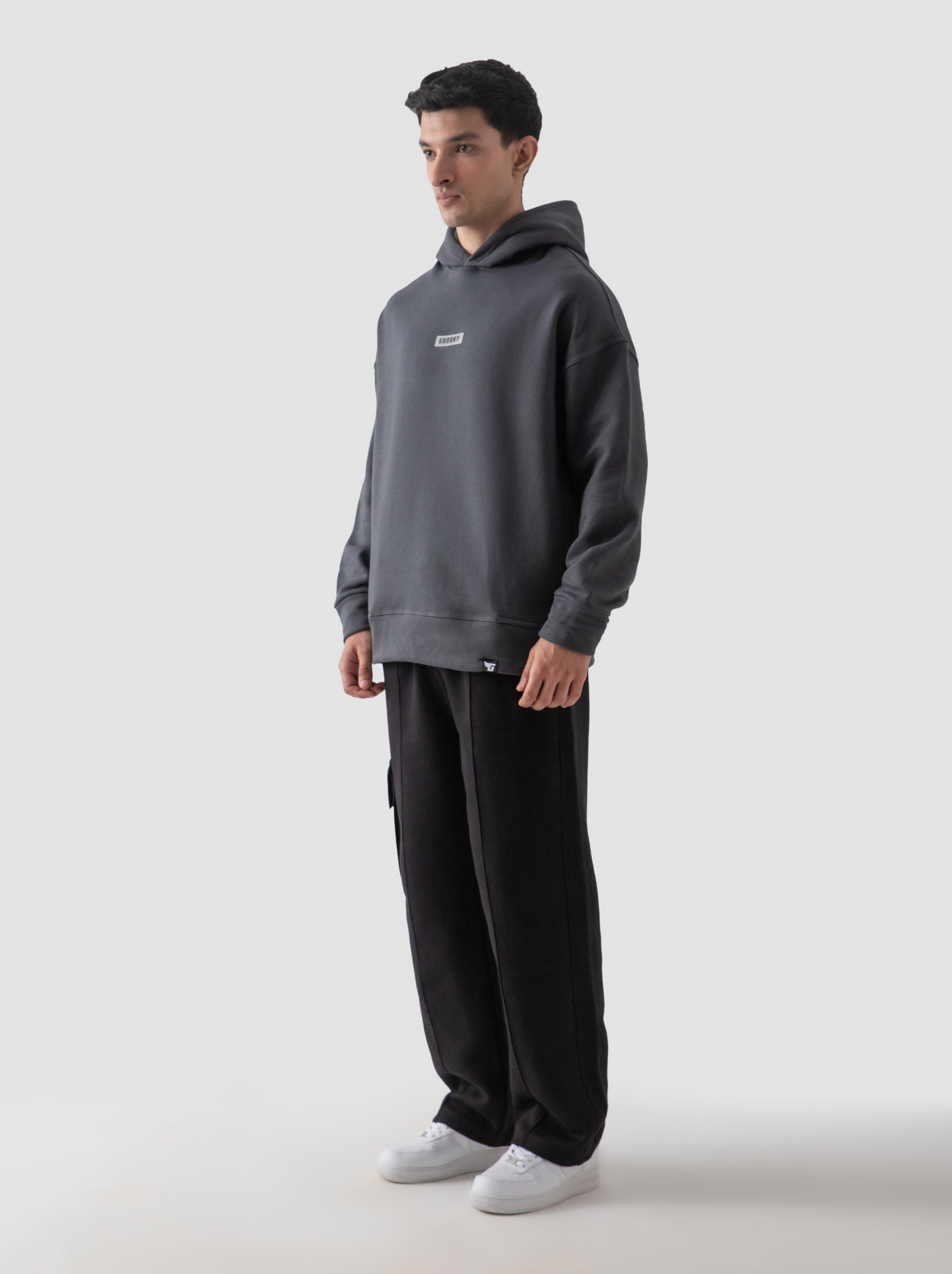 Dark grey hoodie detail closeup kangaroo pocket fabric texture Pakistan – GROOVY