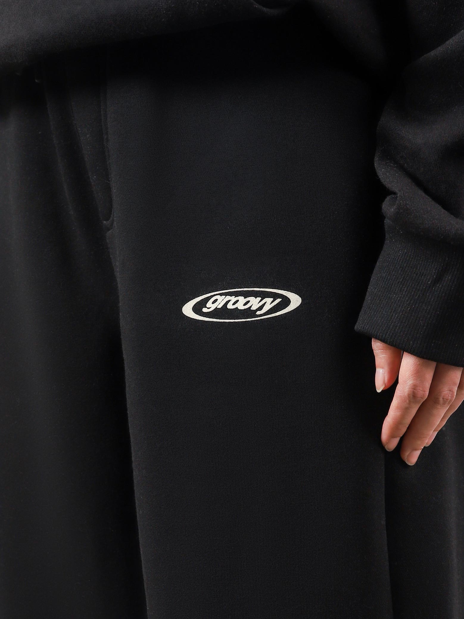 Utility Sweats black male model half body lifestyle shot Pakistan – GROOVY