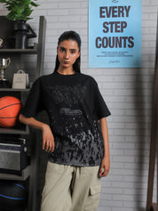 Close-up of GRVY front graphic and motivational quote “Keep That Same Energy” on black heavy-weight streetwear t-shirt.