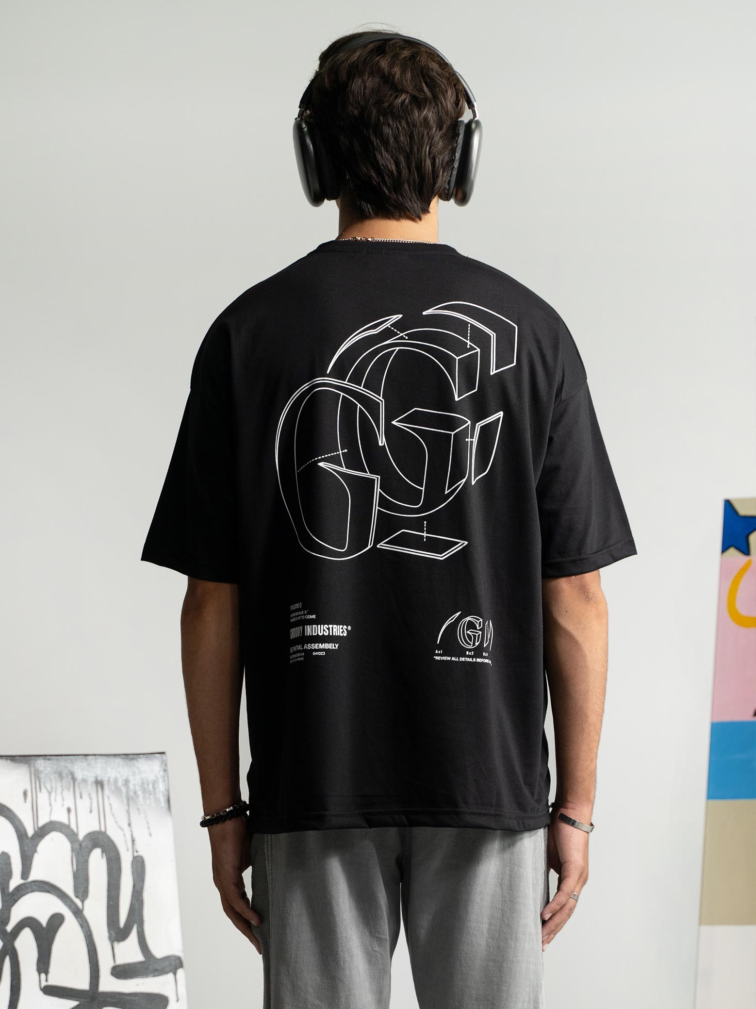 Initial Assembly tee couple lifestyle shot black graphic streetwear Pakistan – GROOVY