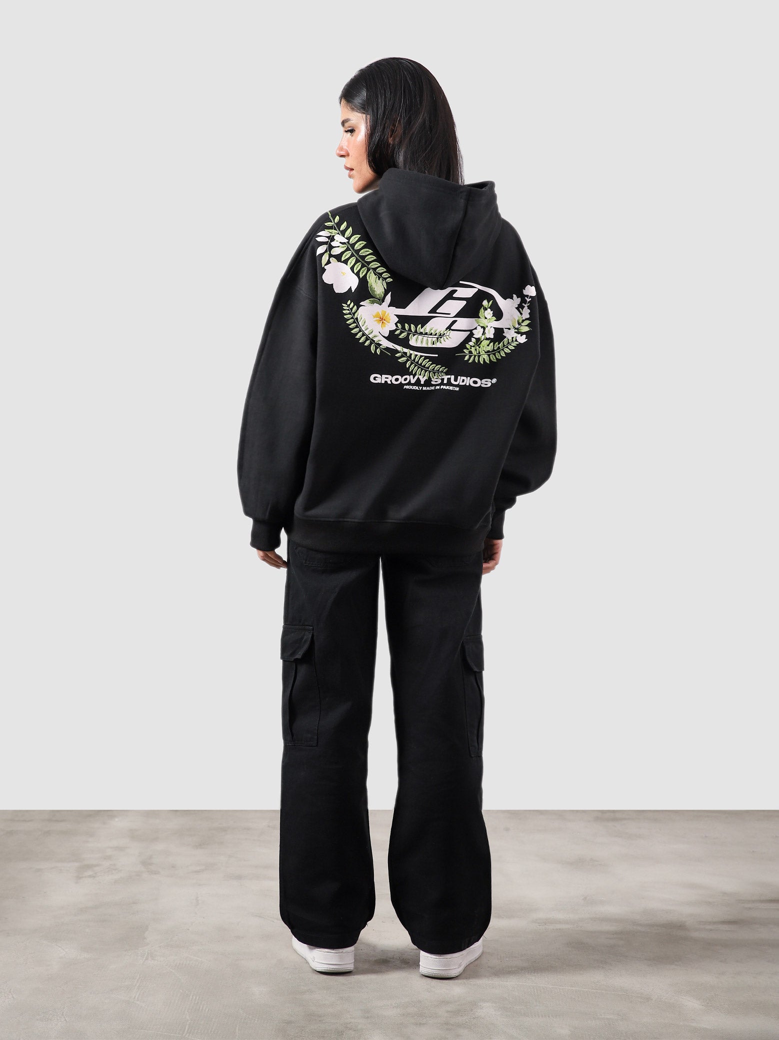 Floral hoodie male model half body lifestyle shot Pakistan – GROOVY