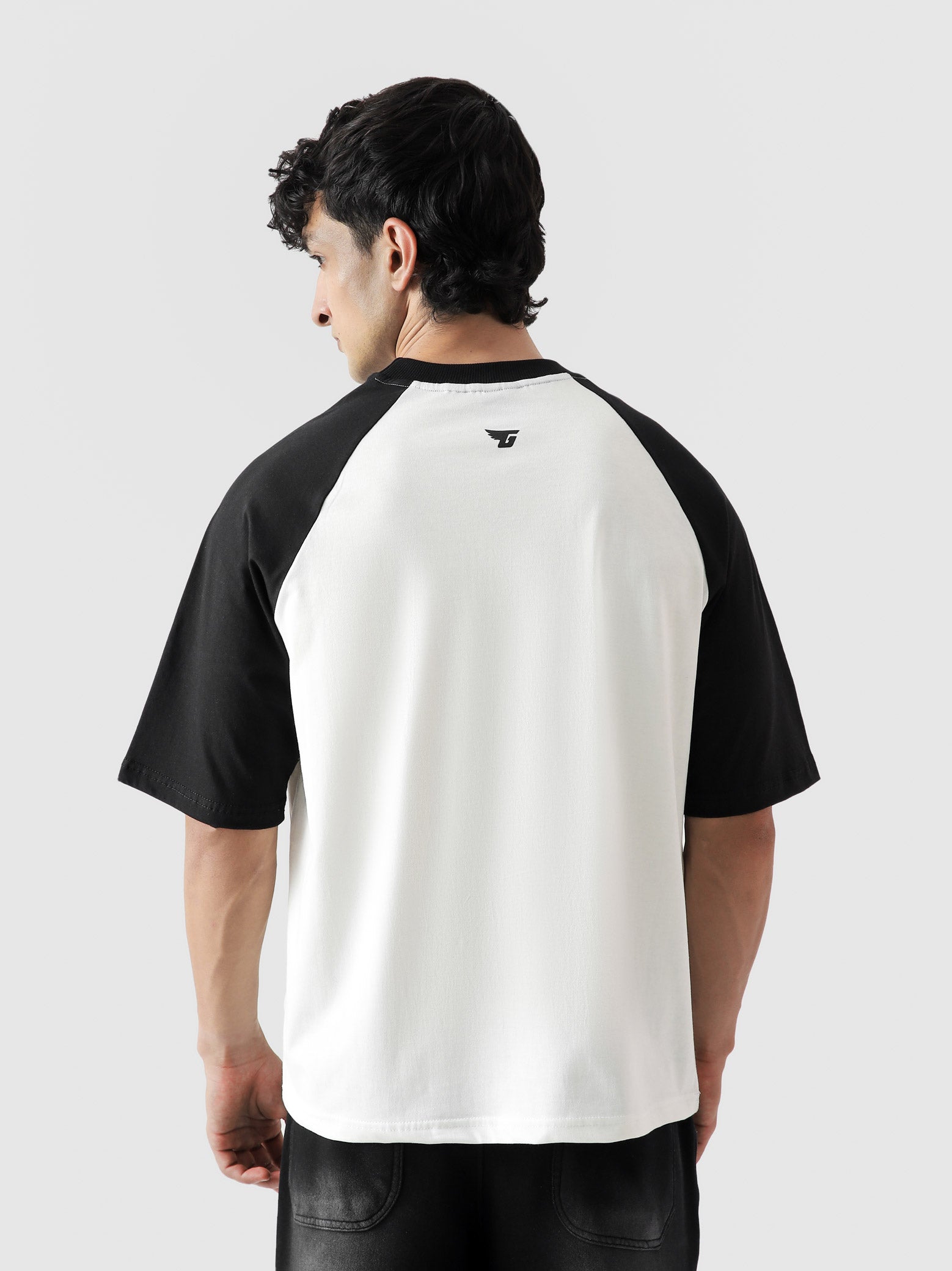 CORE tees black raglan female model back view oversized streetwear Pakistan – GROOVY