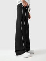 Black piping trouser couple lifestyle shot streetwear Pakistan – GROOVY