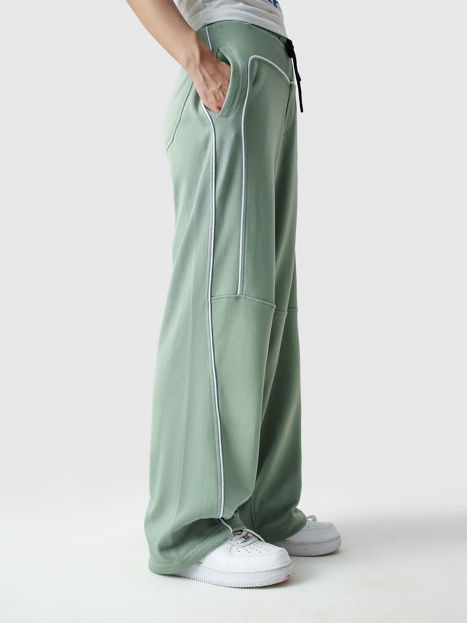 Piping trouser sage green male model outdoor lifestyle shot Pakistan – GROOVY