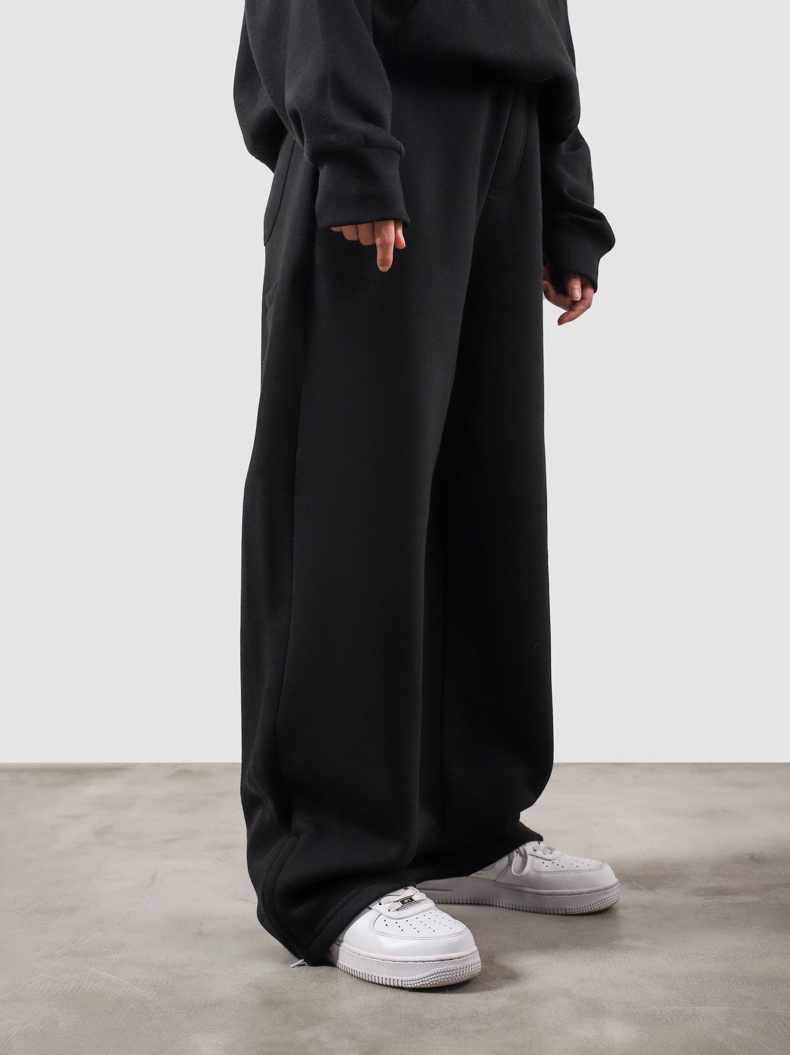 Utility Sweats black female model half body lifestyle shot Pakistan – GROOVY
