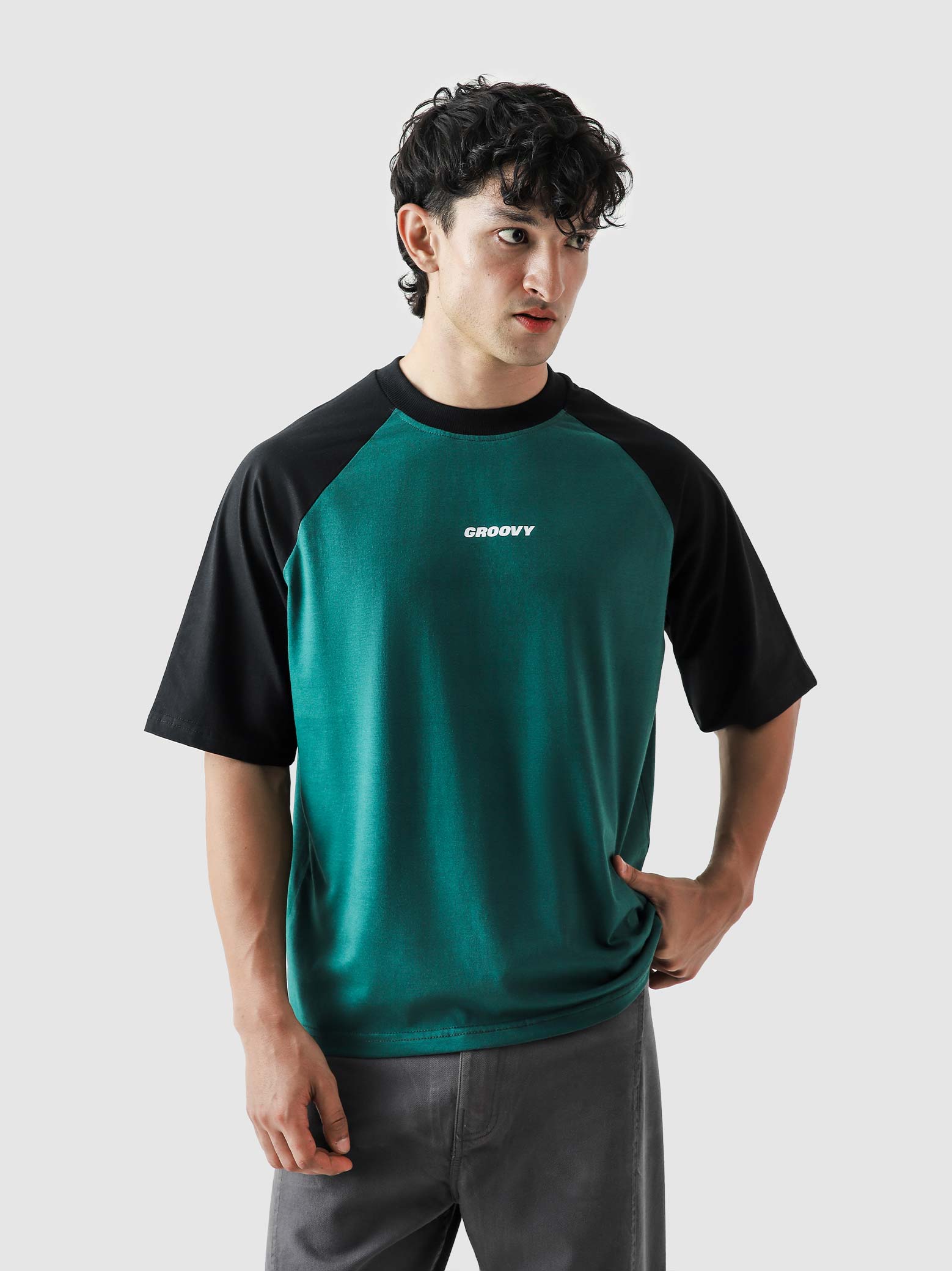 CORE tees racing green raglan couple lifestyle shot streetwear Pakistan – GROOVY