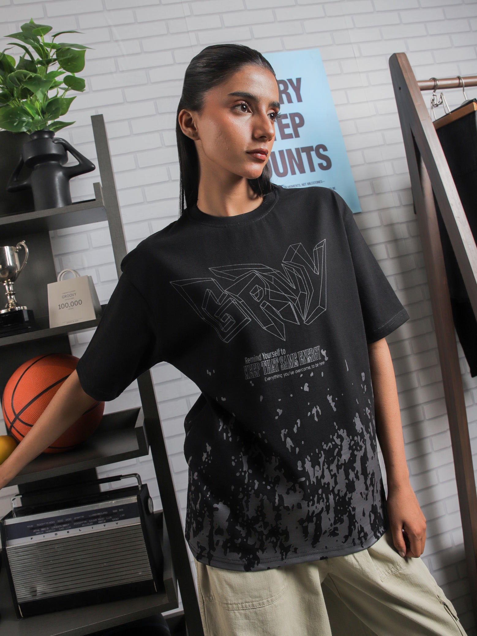 Close-up of GRVY front graphic and motivational quote “Keep That Same Energy” on black heavy-weight streetwear t-shirt.