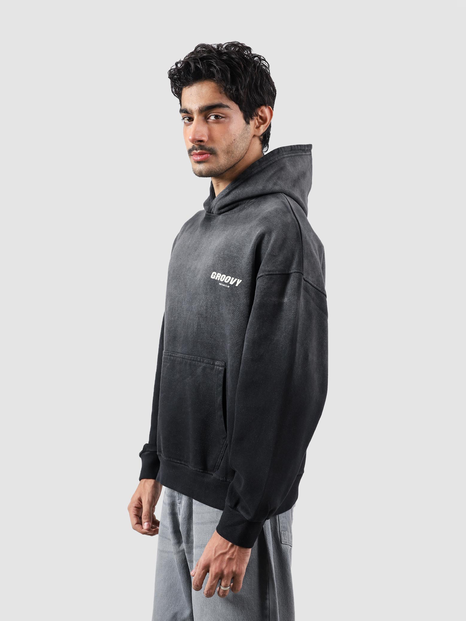 Fade washed hoodie male model outdoor lifestyle shot Pakistan – GROOVY