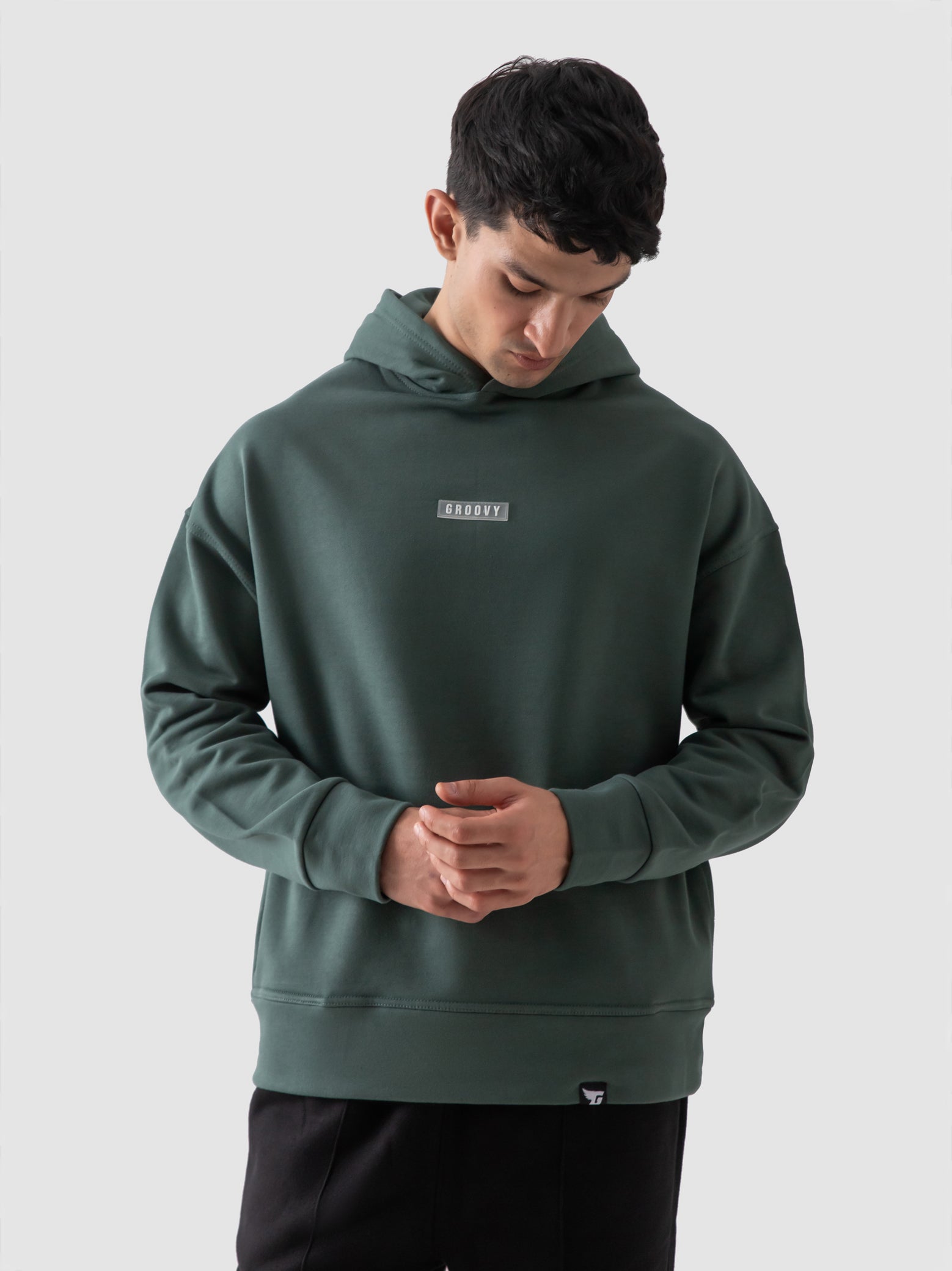 Hunter green hoodie couple lifestyle shot streetwear Pakistan – GROOVY