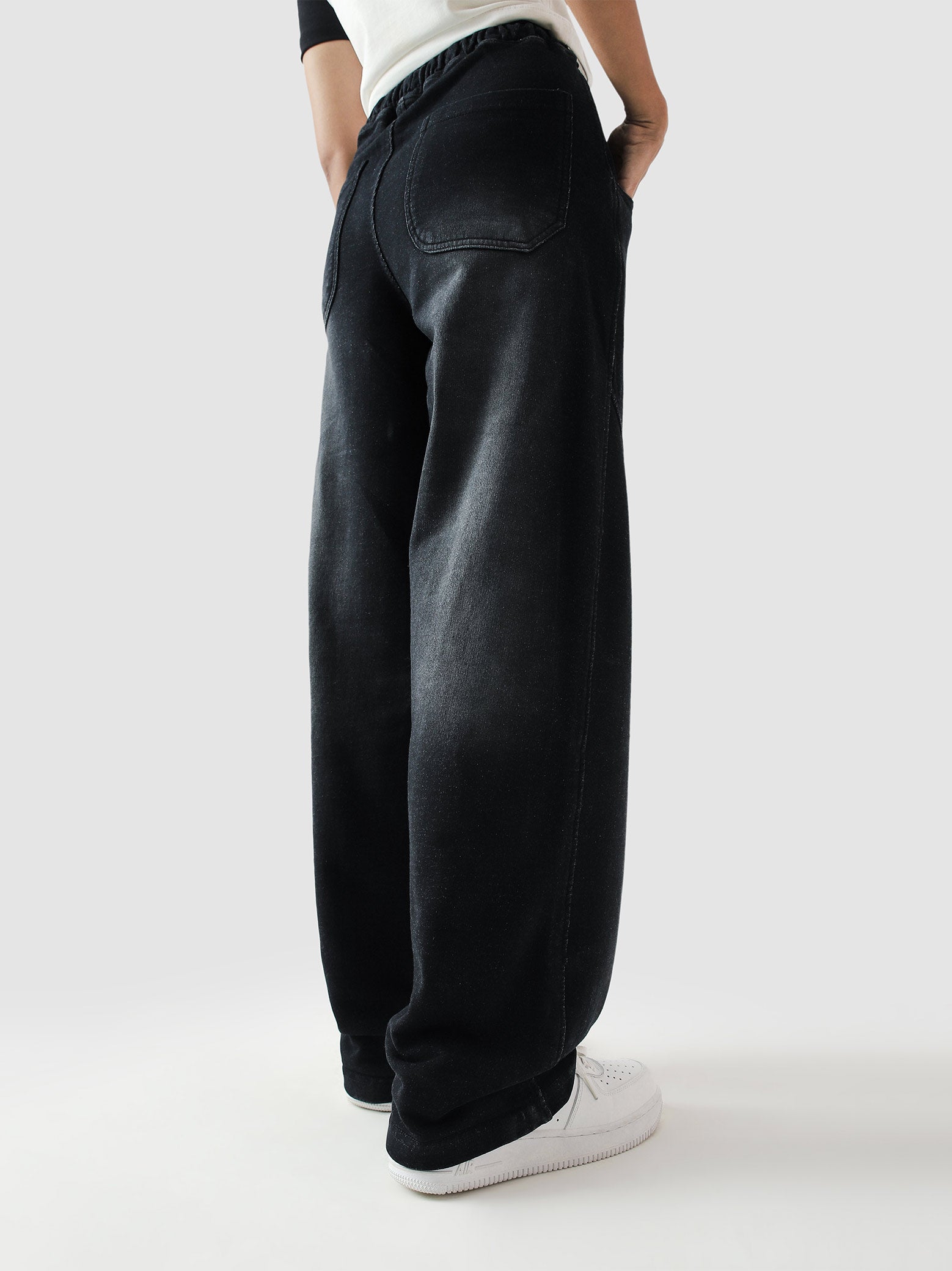Fade washed trouser male model seated lifestyle shot streetwear Pakistan – GROOVY