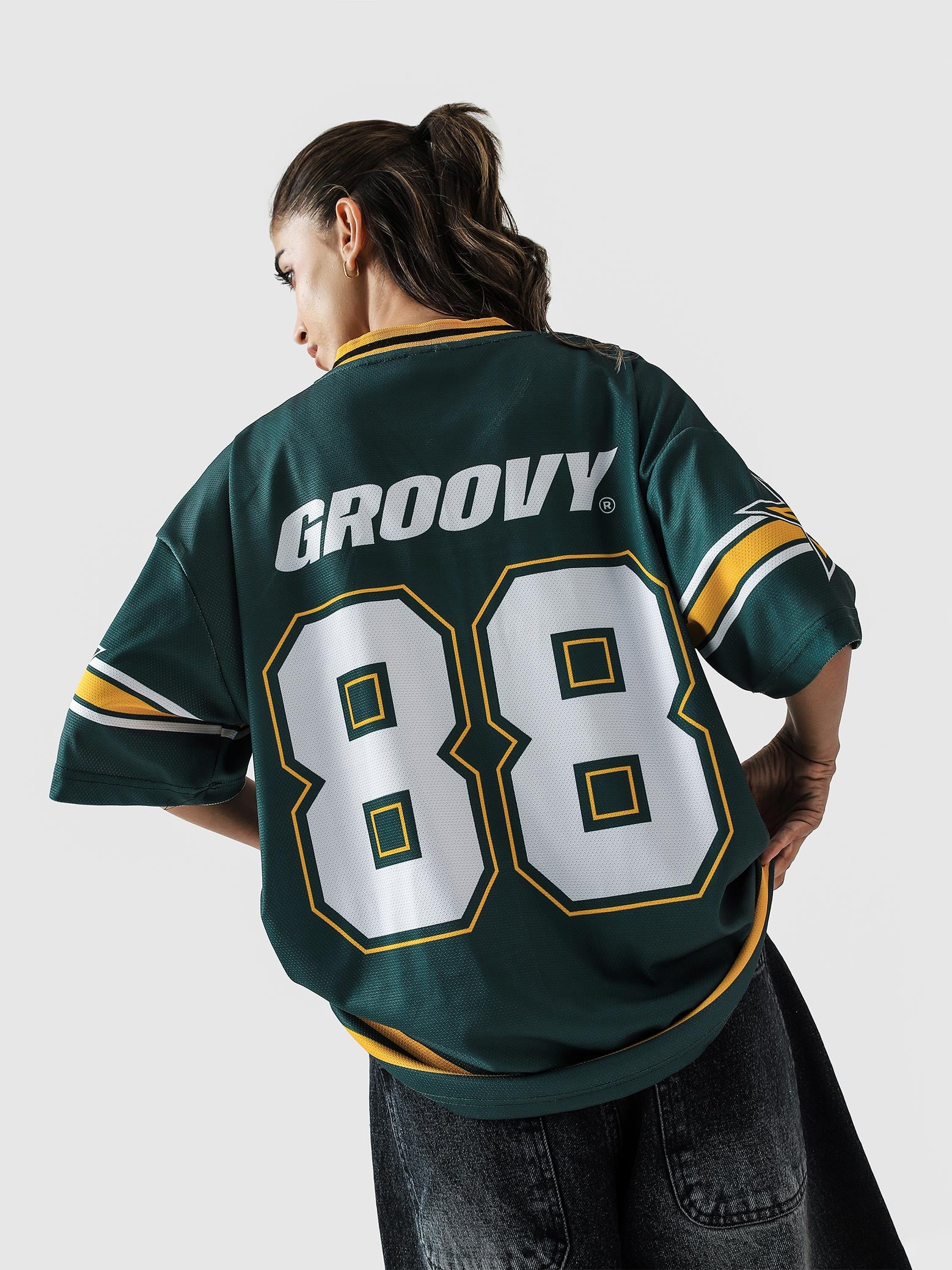 88 Athletics jersey female model back view racing green graphic Pakistan – GROOVY