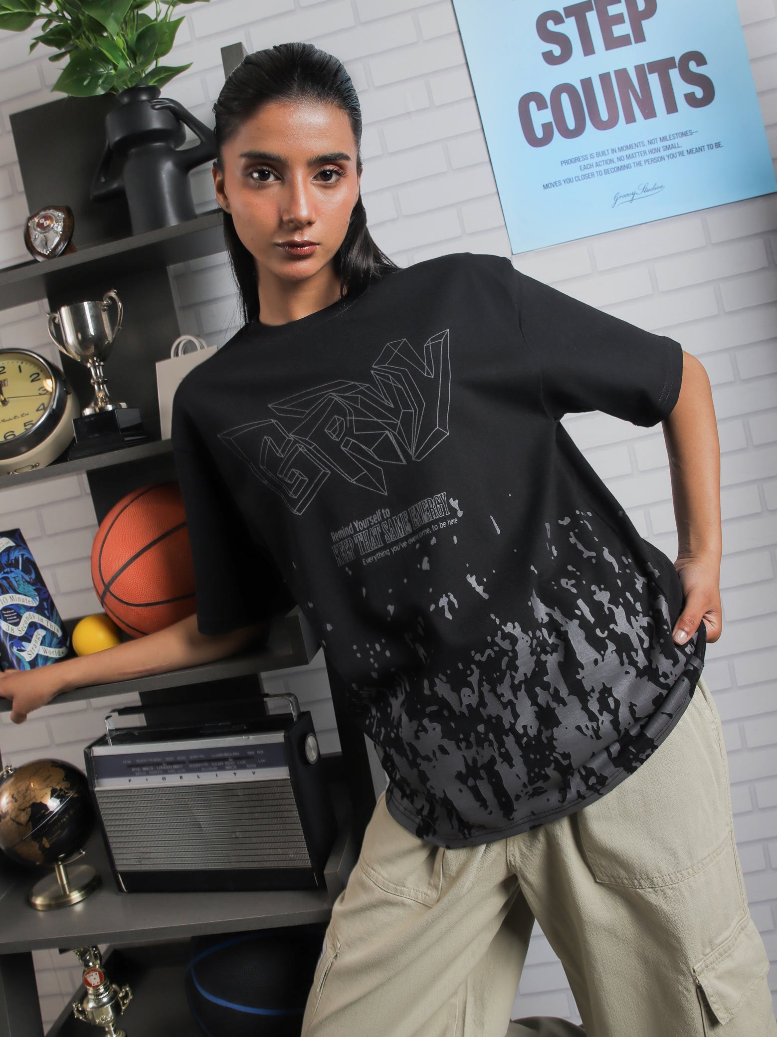 Close-up of GRVY front graphic and motivational quote “Keep That Same Energy” on black heavy-weight streetwear t-shirt.