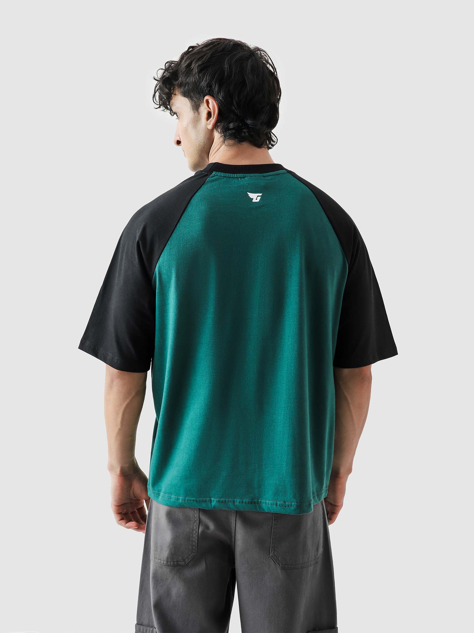 CORE tees racing green raglan male model outdoor lifestyle shot Pakistan – GROOVY