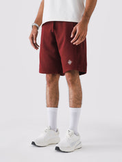 Man wearing Wine Red Aim Shorts, GROOVY men's sport and lounge shorts, Pakistan streetwear