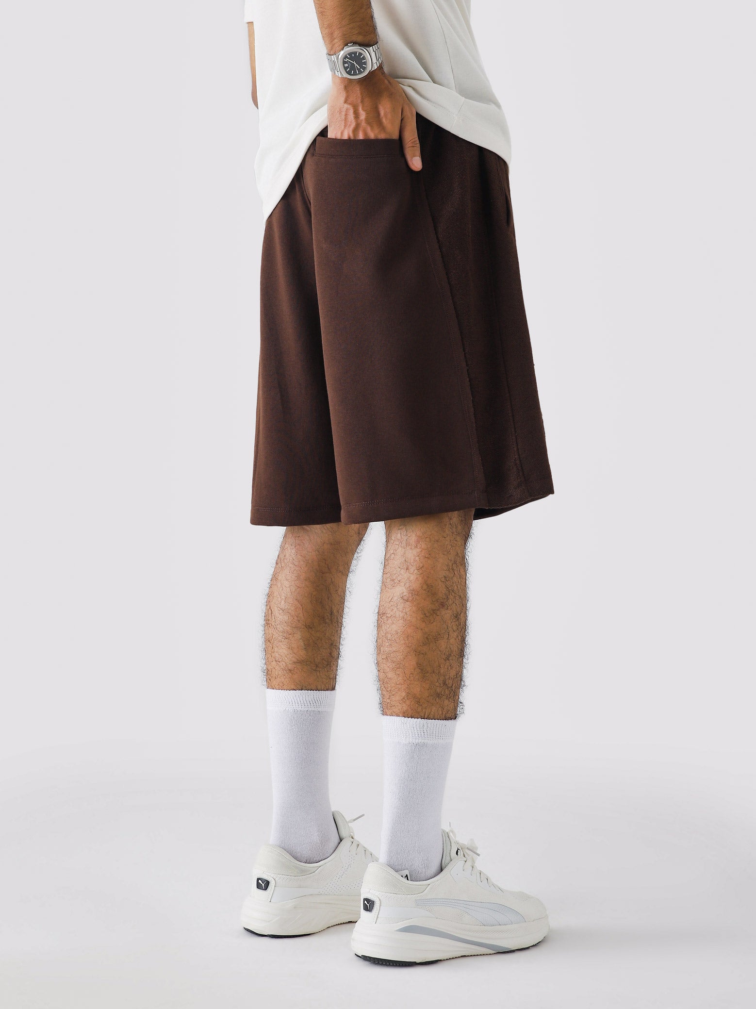 Mocha Brown Aim Shorts on model, relaxed-fit men's gym and casual shorts by GROOVY Pakistan