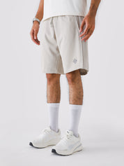 Man wearing Ash Grey Aim Shorts, GROOVY men's sport and lounge shorts, Pakistan streetwear