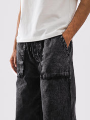 Elastic waist and exposed drawstring on baggy cargos - GROOVY Pakistan