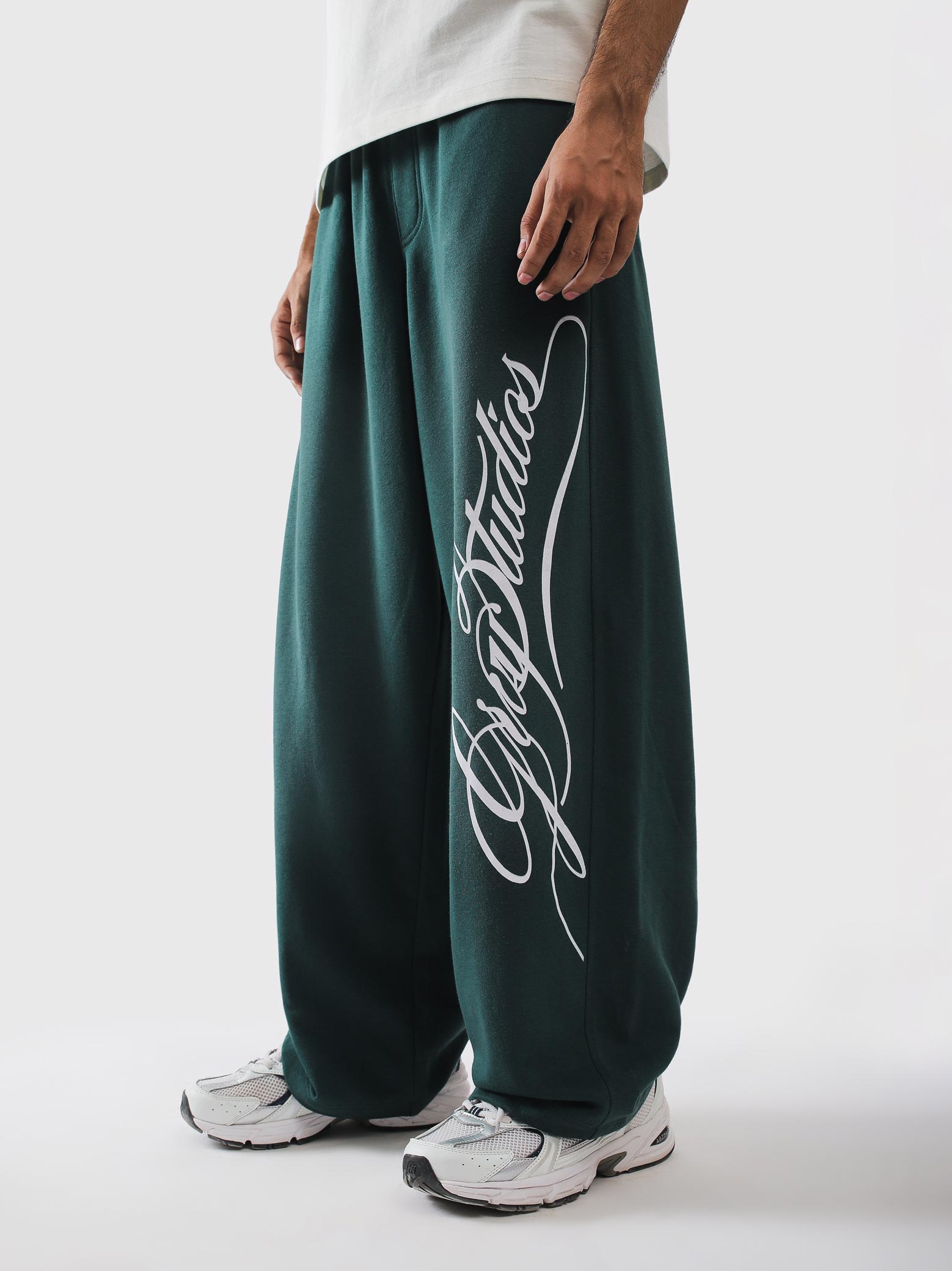 Deep green terry sweatpants with script print - Script Sweats | GROOVY Pakistan