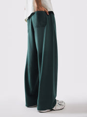 Deep green sweatpants styled with a cream tee - GROOVY Pakistan