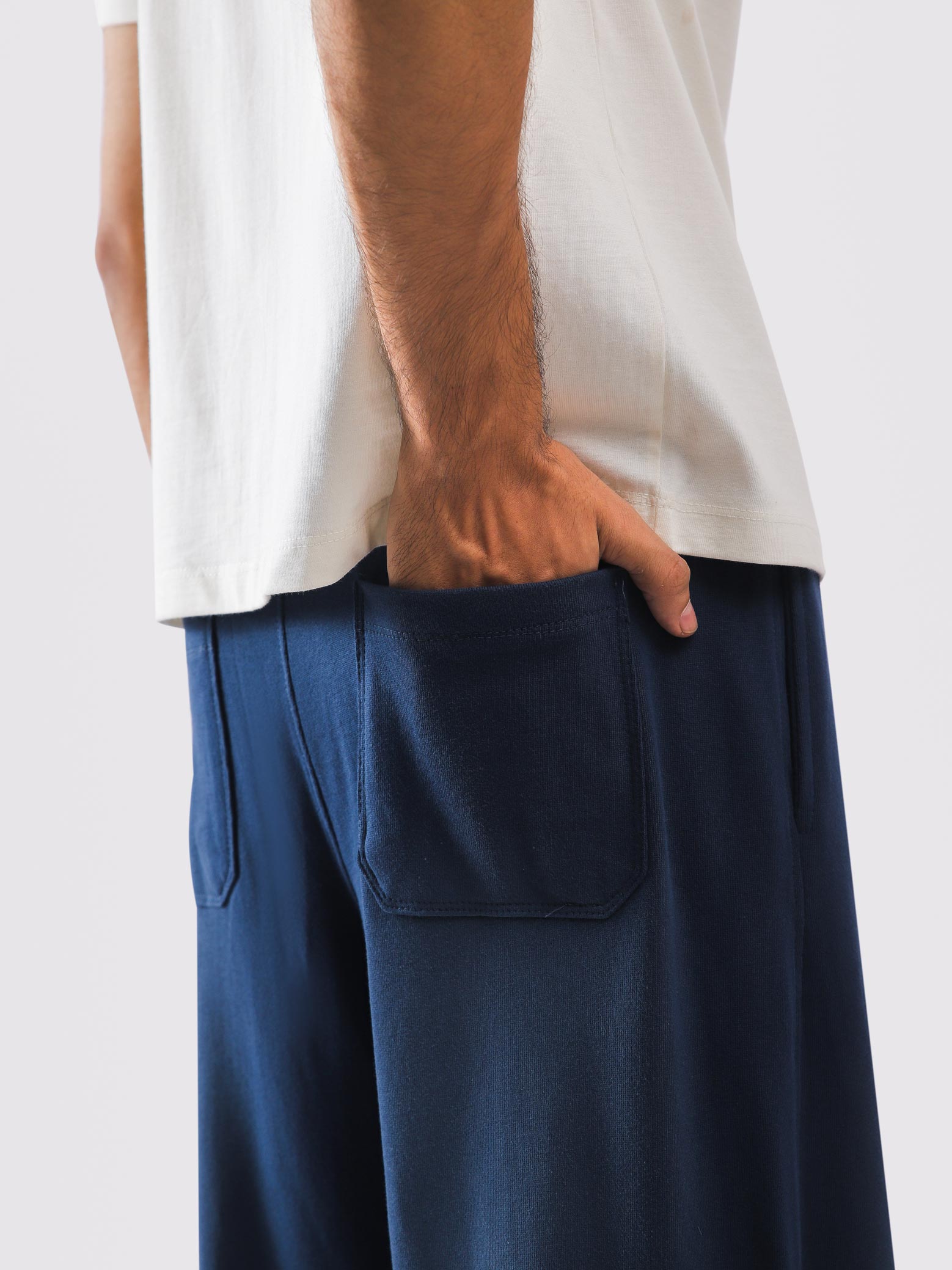 Baggy blue sweatpants full length on model - GROOVY Pakistan