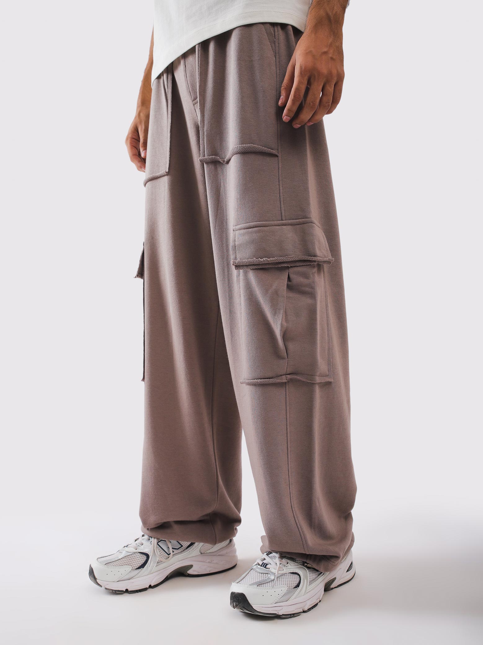 Twin raw edge flap cargo pockets on the outer leg - GROOVY Pakistan
