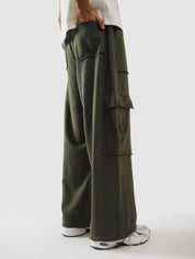Raw edge flap pockets stacked down the olive leg - GROOVY Pakistan